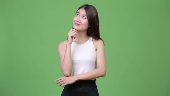Young Beautiful Asian Businesswoman Thinking