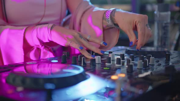 DJ Hands Control Sound Console for Mixing Music in Disco Club alt