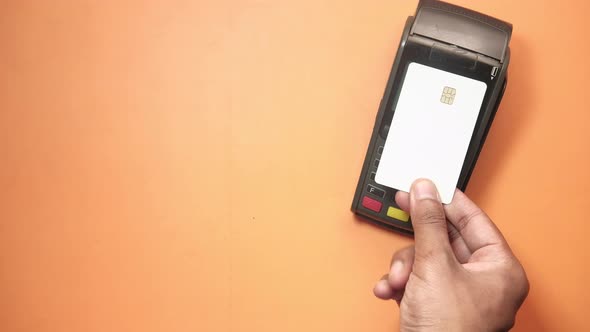 Payment Terminal Charging From a Card, Contactless Payment. alt