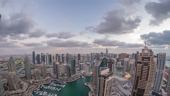 Dubai Marina Skyscrapers and Jumeirah Lake Towers View From the Top Aerial Day to Night Timelapse in alt