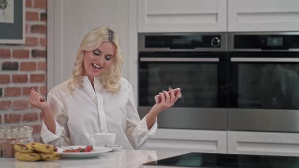 Portrait of Cheerful Woman Singing Song on Dometic Kitchen in Slow Motion