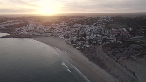 Sunset wide aerial view of Praia da Luz beach, Algarve, Portugal. Holidays destination alt