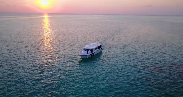 Daytime above abstract shot of a paradise sunny white sand beach and aqua turquoise water background alt