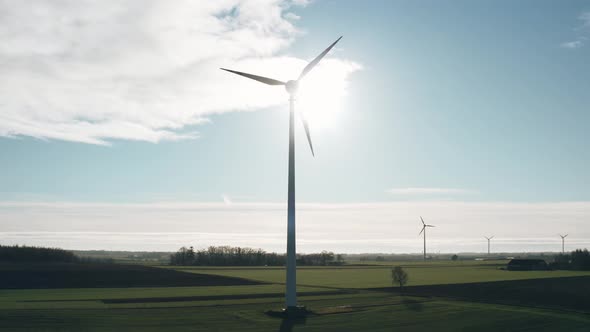 Aerial Drone View Windmills Wind Turbines Producing Clean Ecological Electricity By Road in Green alt