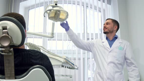 Dentist Prepares for Appointment of Patient