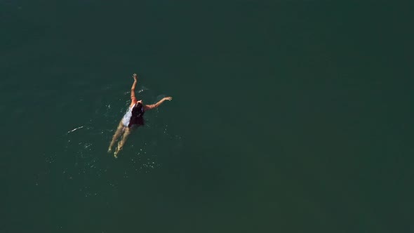 Top View of a Young Woman Swimming