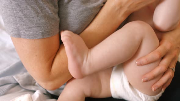 Mother feeding milk to her baby alt