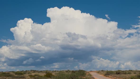 Storm Cell Over Dirt Road Zoom Out