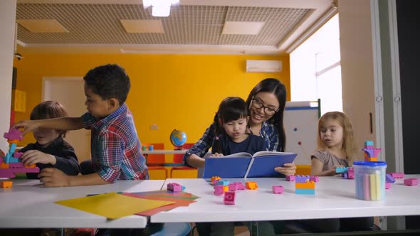 Diverse Kids with Teacher Learning in Classroom alt