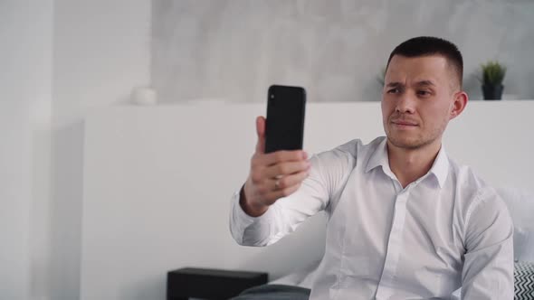 Confident Man Speaking with His Friends in Online Chat alt