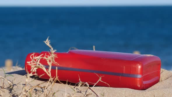 Plastic Chemical Bottle on Sand Beach. Ecology