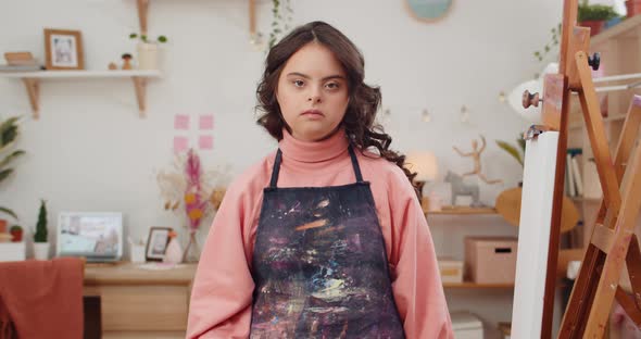 Pretty Female Teen with Genetic Disorder Showing Peace Sign While Looking and Posing To Camera alt