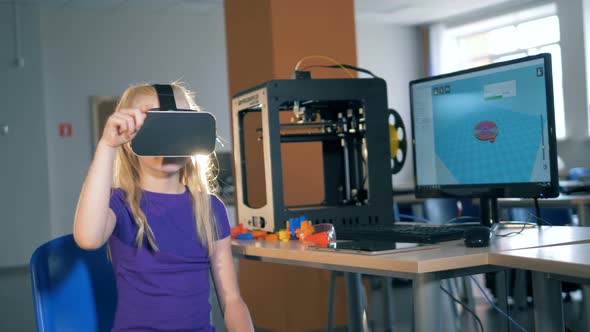 Virtual Reality Glasses Are Being Worn By a Girl While Playing alt