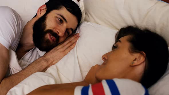 Couple sleeping together on bed alt