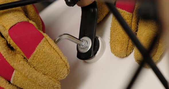 Man hand bolt is rotated. Assembles furniture. Close up. alt