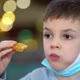 Preschooler Boy in Medical Mask Eats Chicken Nuggets From Fast Food Restaurant - VideoHive Item for Sale