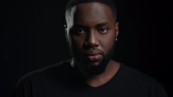 Cheerful Afro Guy Posing Indoors alt