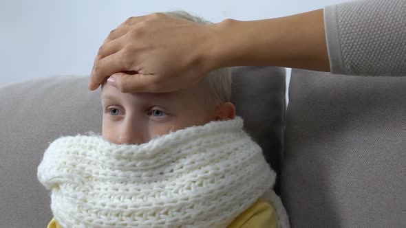 Mother Hand Stroking Sick Child Forehead Checking Temperature, Parenthood Care