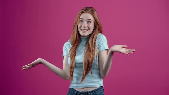 The Freckled Redhead Shrugs Uncertainly About Her Answer and Smiles Broadly Changing Her Gaze in alt