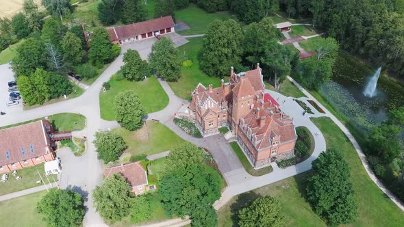 Jaunmoku Brick Medieval Castle Near Tukums, Latvia  Aerial Dron 4k Shot Jaunmokas Manor Park. alt