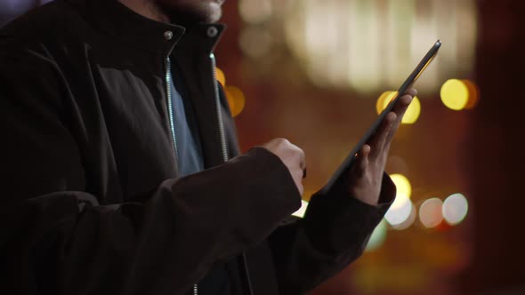 Guy Hands Surfing Internet on Tablet Outdoors. Man Hands Using Tablet on Street. alt