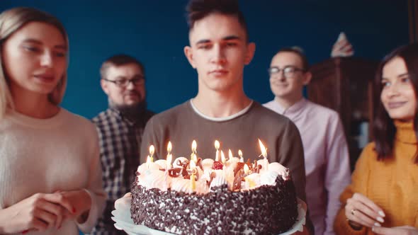Concept Family Celebration Happy Young Man Blows Out Candles Cake Family Applauding alt