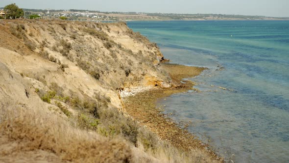 Blue waters and coastal scene of Clifton Springs Australia. PAN UP SHOT. alt
