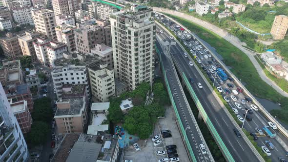 Aerial footage of Morning rush hour of traffic to enter the town in shenzhen city, China. Hypelapse alt
