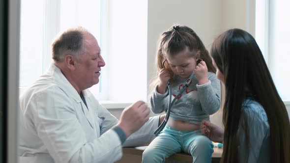 Little patient putting phonendoscope on