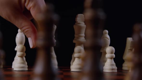 Hand Moving A Pawn Piece On A Chessboard 20