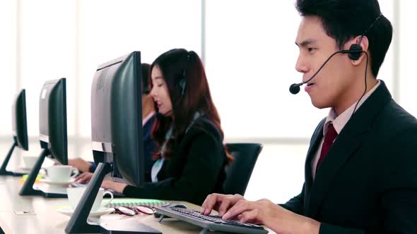 Business People Wearing Headset Working in Office alt