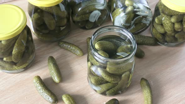 Glass jars with pickled cucumbers. Marinated pickled cucumbers.