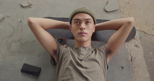 Fashionable young man in an abandoned warehouse alt