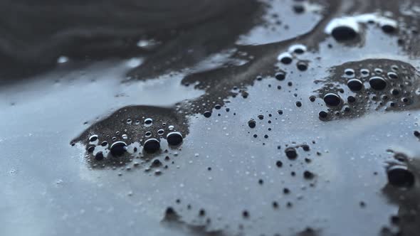 Rotation Of Bubbles From Black Paint Background