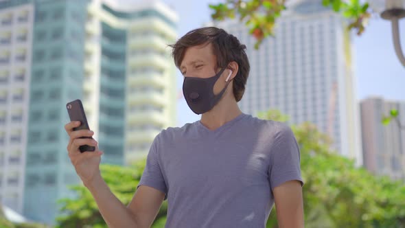 Fashionable Black Medical Mask with a Filter in the City. Coronavirus 2019-Ncov Epidemic Concept alt