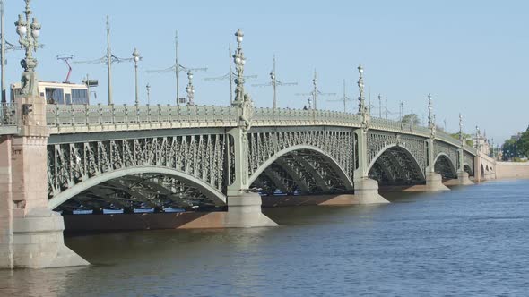Tram moves on the Trinity (Troitsky) bridge in the summer - St Petersburg, Russia
