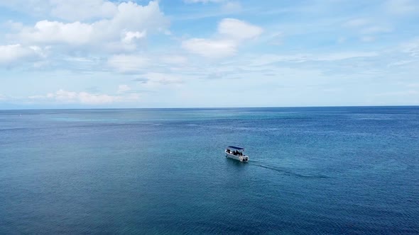 Aerial drone flying over aing dive boat on stunning coral reef ocean at tropical island getaway dest alt