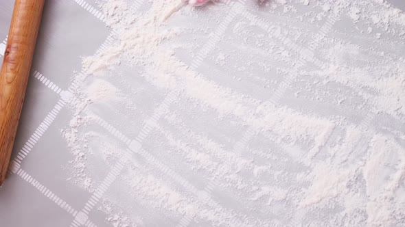 Apple Pie Preparation Series  Woman Covers Table with Flour for Rolling Dough alt