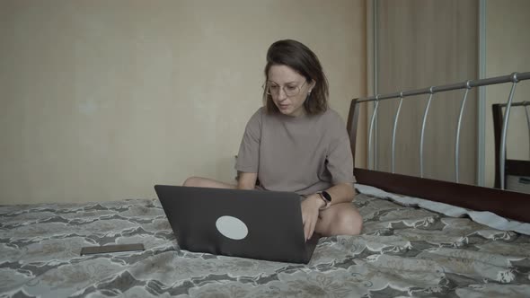 Woman Using Laptop During Remote Work