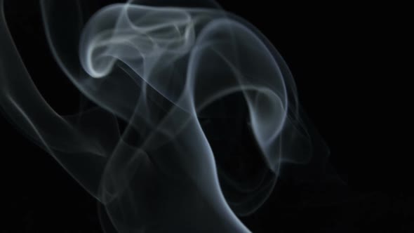 Cigarette smoke on a black background alt
