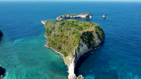 Fly Around Cliff and Rocks Over Ocean Along Coast alt