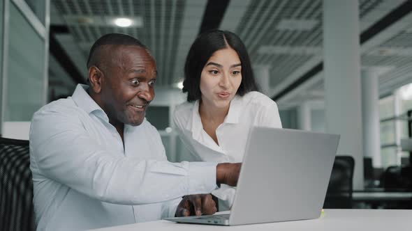 African American Businessman Work on Laptop at Office Chatting Online Young Woman Trainee Come to alt