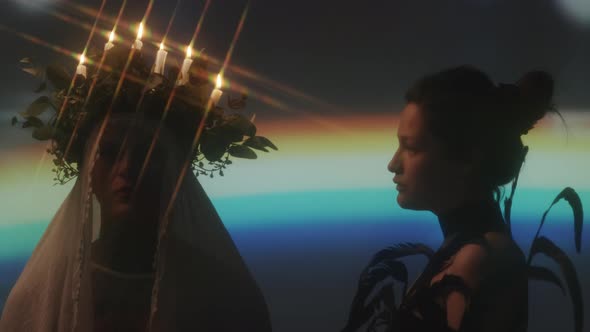 Man with Candle Lit Wreath and Woman in Feathers alt