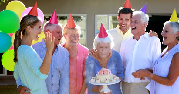 Doctors and senior citizen celebrating birthday alt