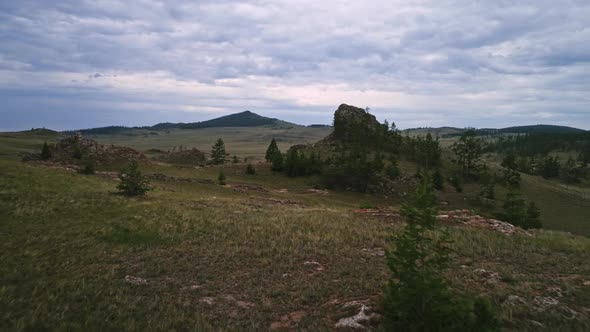 Baikal Valley spirits,Tazheran Steppe, Stone Cliffs on the Road, Aerial Summer alt