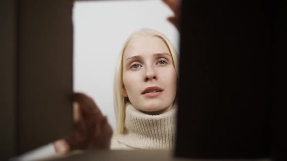 Close Up Inside of Carton Box Bottom View Woman Opens Parcel Looks at Delivered Goods Items Feels alt