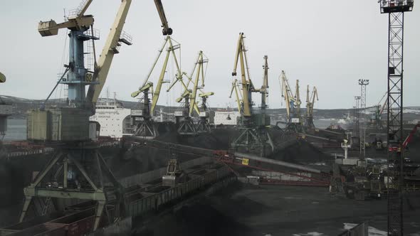 Sea Vessels for Transport of Coal are Loaded in Sea Port with Help of Huge Cranes and Conveyor Belts