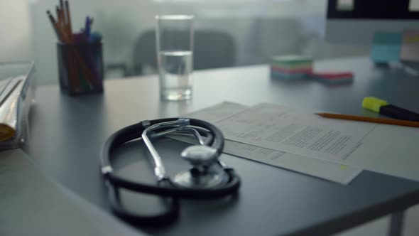 Closeup Modern Doctor Desktop in Clinic alt