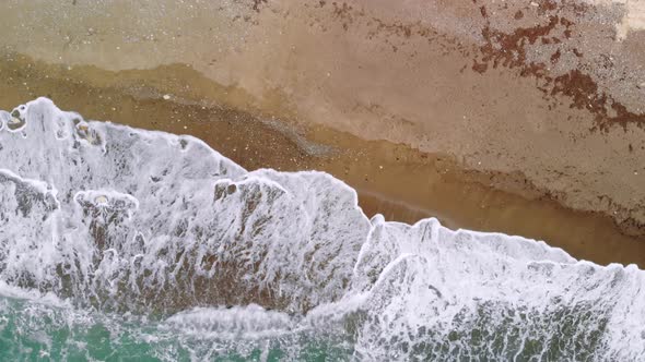 Powerful Waves Crashing on Deserted Sandy Beach, Top View alt