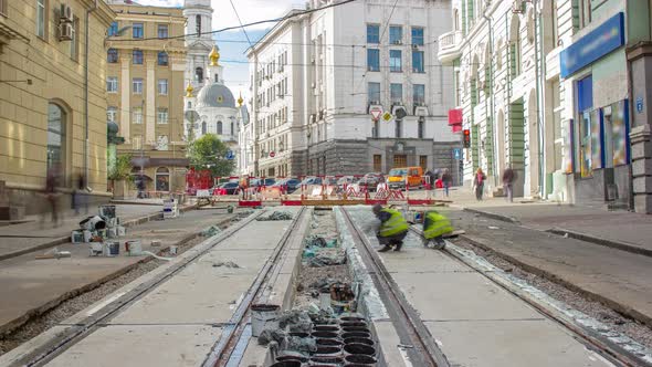 Workers Do Cleaning of the Railway Tram Line After Construction Works alt